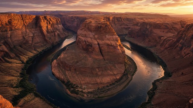 Deep red rock canyon with a river making a horseshoe bend, golden hour light, aerial viewpoint, original AI nature wallpaper