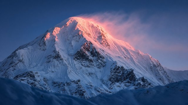 Massive snowy mountain face at blue hour with pink alpenglow on the summit, wind-blown snow plume, telephoto landscape, original AI nature wallpaper